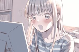 パソコン画面を見て驚く女性